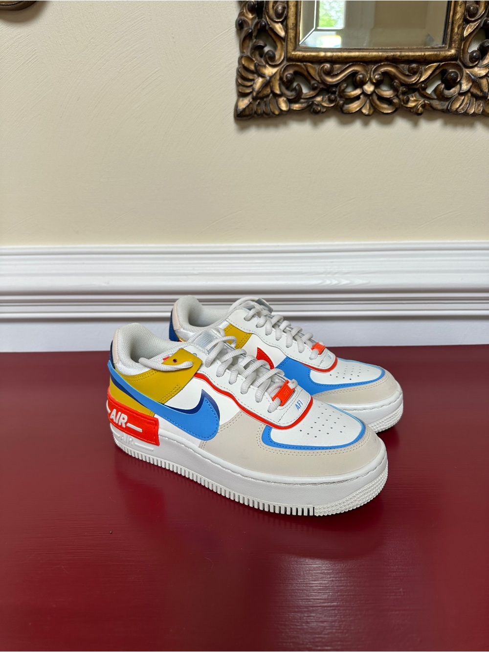 Nike White Leather Sneakers with Blue, Yellow, Red and Orange Accents